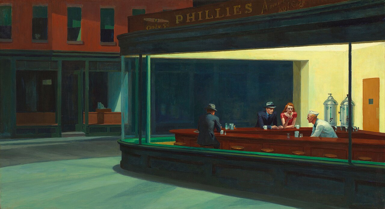Customers and a server in a bright diner on an empty street at night.